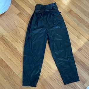 Black faux leather paper bag pants